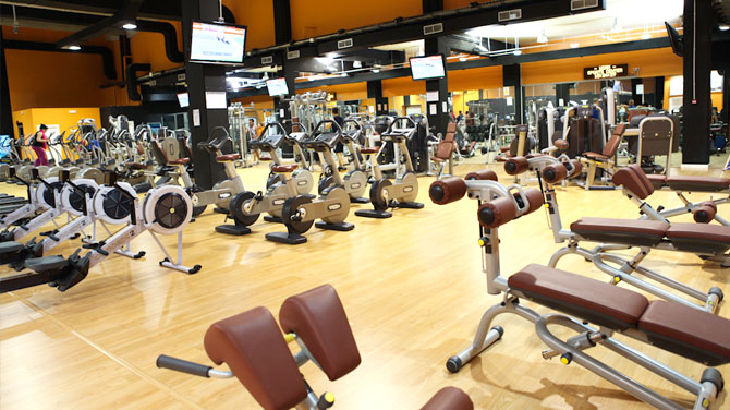 A gym with lots of exercise equipment