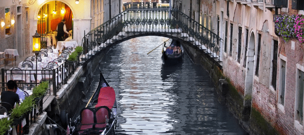 Gondolas paddling along a canal