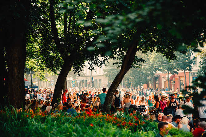 People enjoying gathering at a public festival