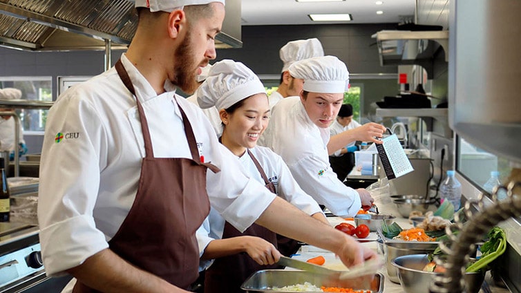 Culinary arts students in a professional kitchen