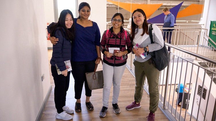 Four students pose for a picture together