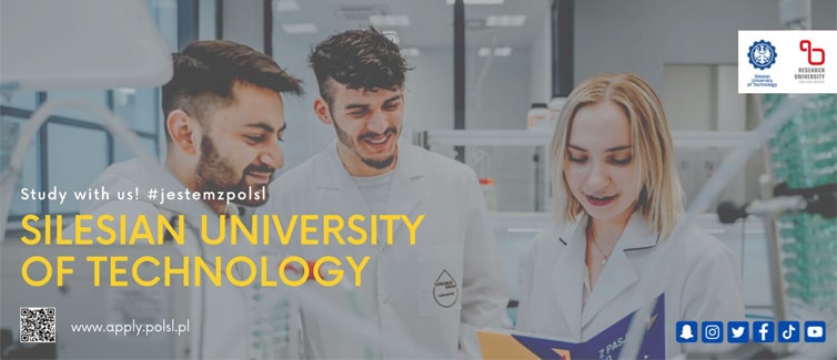 Three students dressed in white in a lab