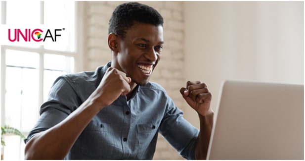 Smiling student at laptop