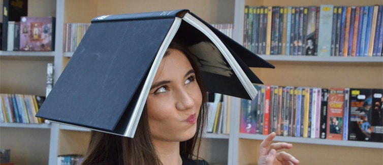 Lady with book on her head