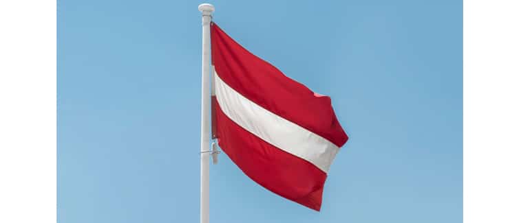 Image of a red and white flag, the flag of austria, on a flagpole