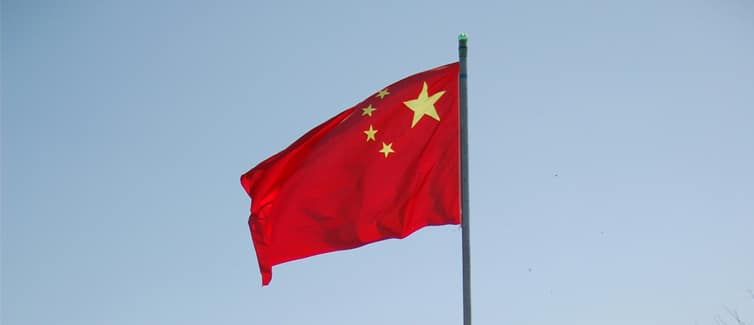 Image of a red and yellow Chinese flag on a flagpole