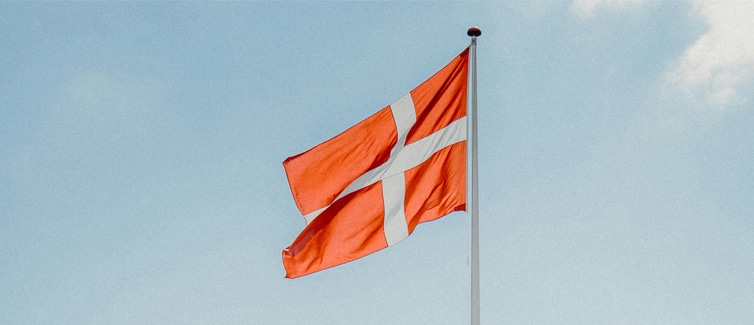 Image of a red and white Denmark flag on a flagpole