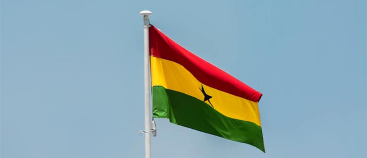 Image of a red, yellow and green flag on a flagpole
