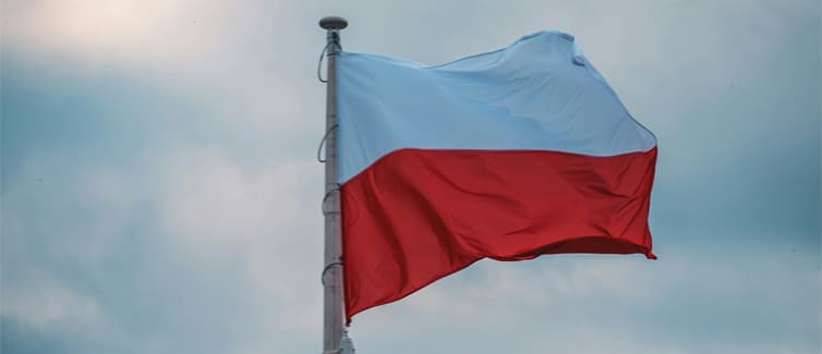 Image of a red and white Polish flag on a flagpole