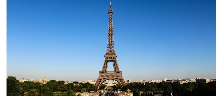 Image of the Eiffel Tower with a blue sky in the background